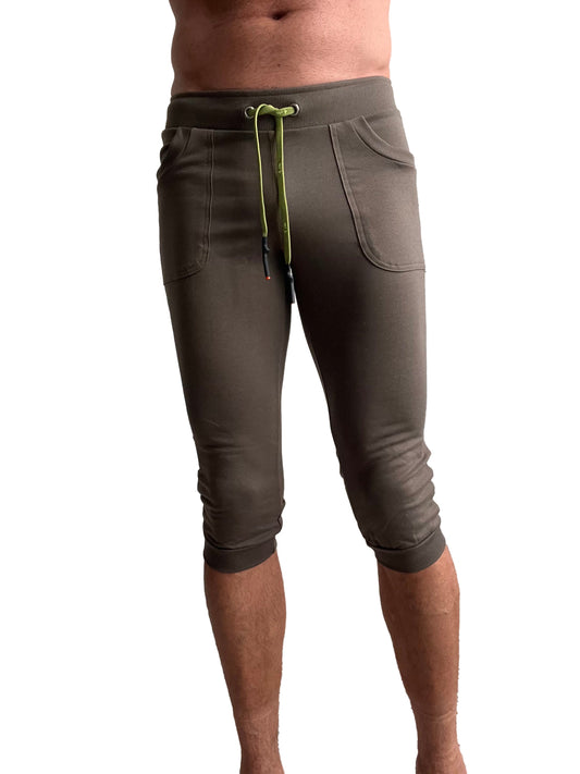 Olive green cuffed yoga pants with lime green drawstring and side pockets in capri-length jogger style