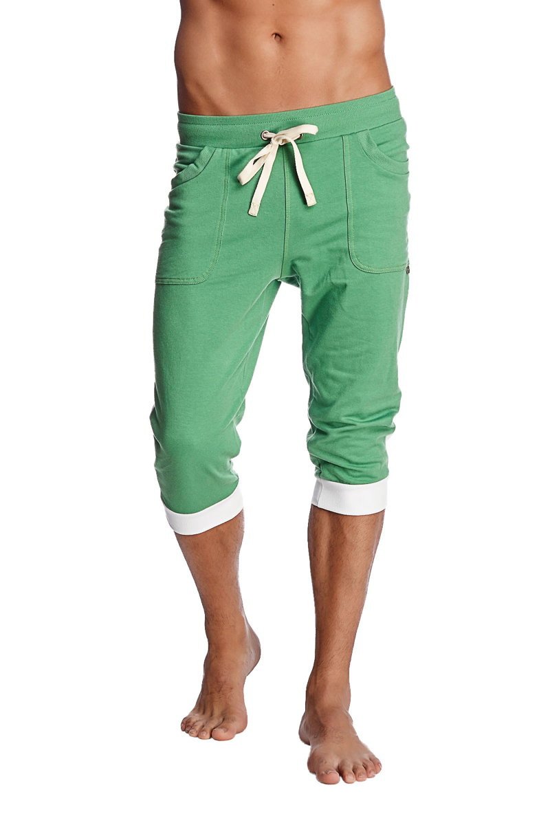 Cuffed yoga pants in bamboo green with white drawstring and contrasting white cuffs made from soft fabric