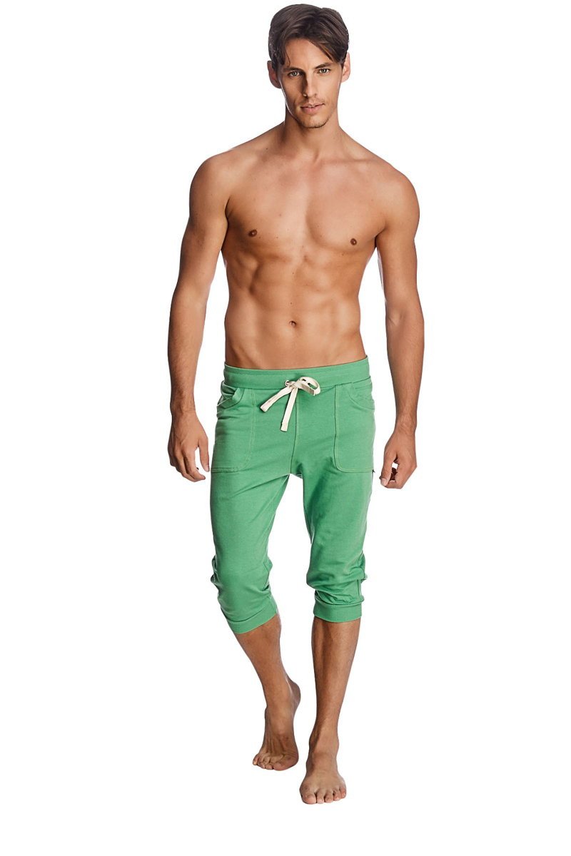 Green capri-length cuffed yoga pants with white drawstring and side pockets made from bamboo fabric