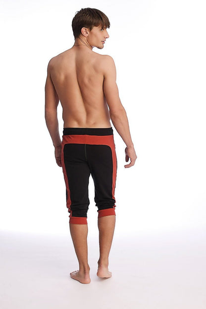 Black and cinnabar cuffed yoga pants with elastic waistband ribbed cuffs ideal for athletic wear