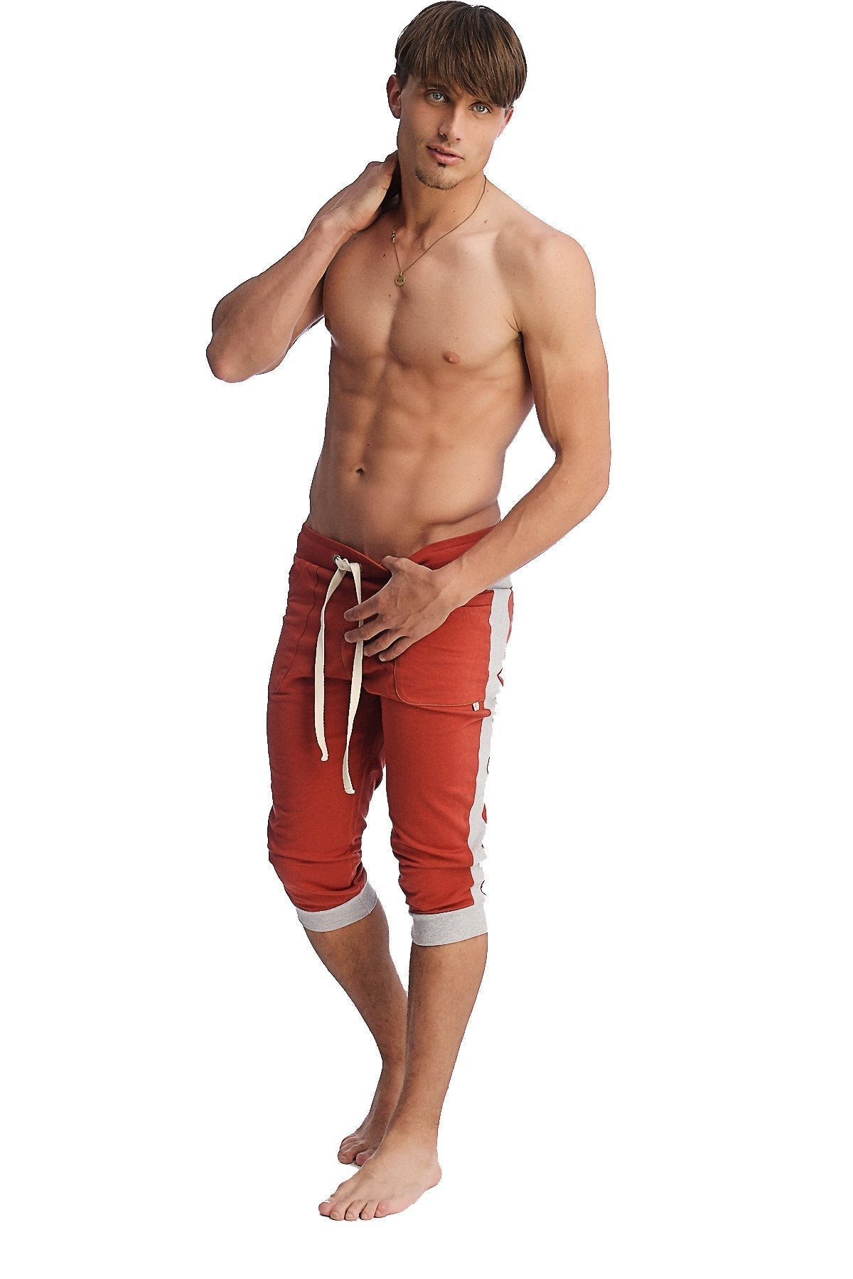 Red athletic shorts with white side stripes and matching drawstring ideal for active wear and casual comfort
