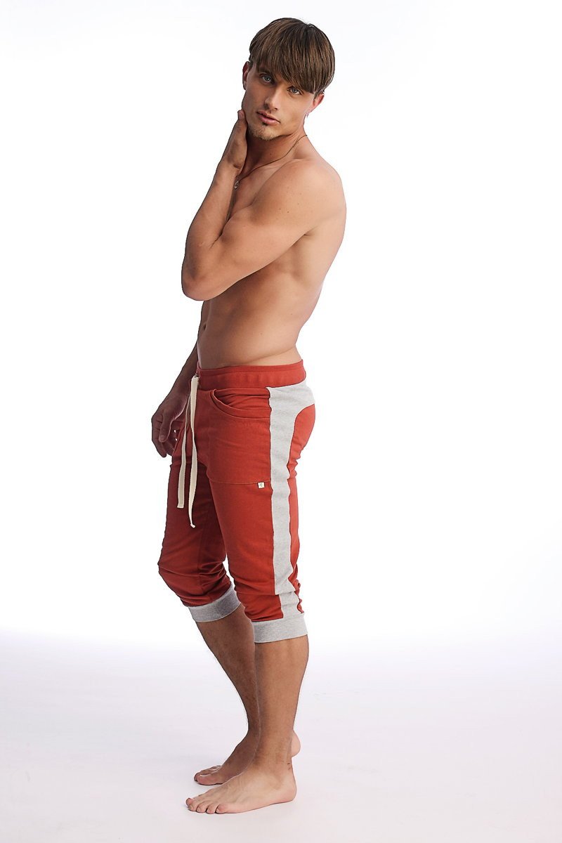 Red and white cuffed yoga pants with drawstring waistband made from athletic material for comfortable workouts