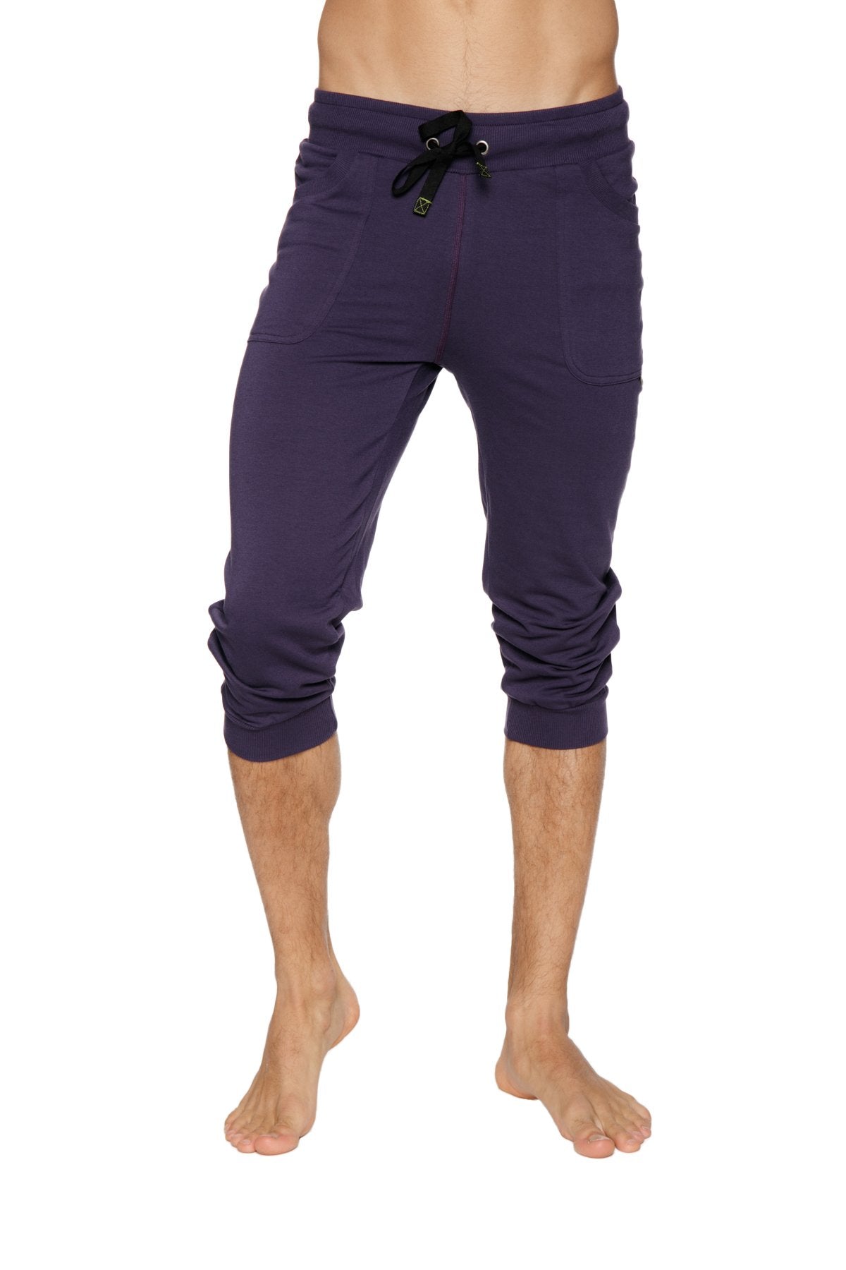 Cuffed yoga pants in navy blue capri length with black drawstring waistband and rolled cuffs for comfortable wear