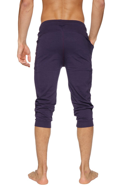 Dark purple cuffed yoga pants with stretchy fabric and elastic waistband for comfortable activewear use