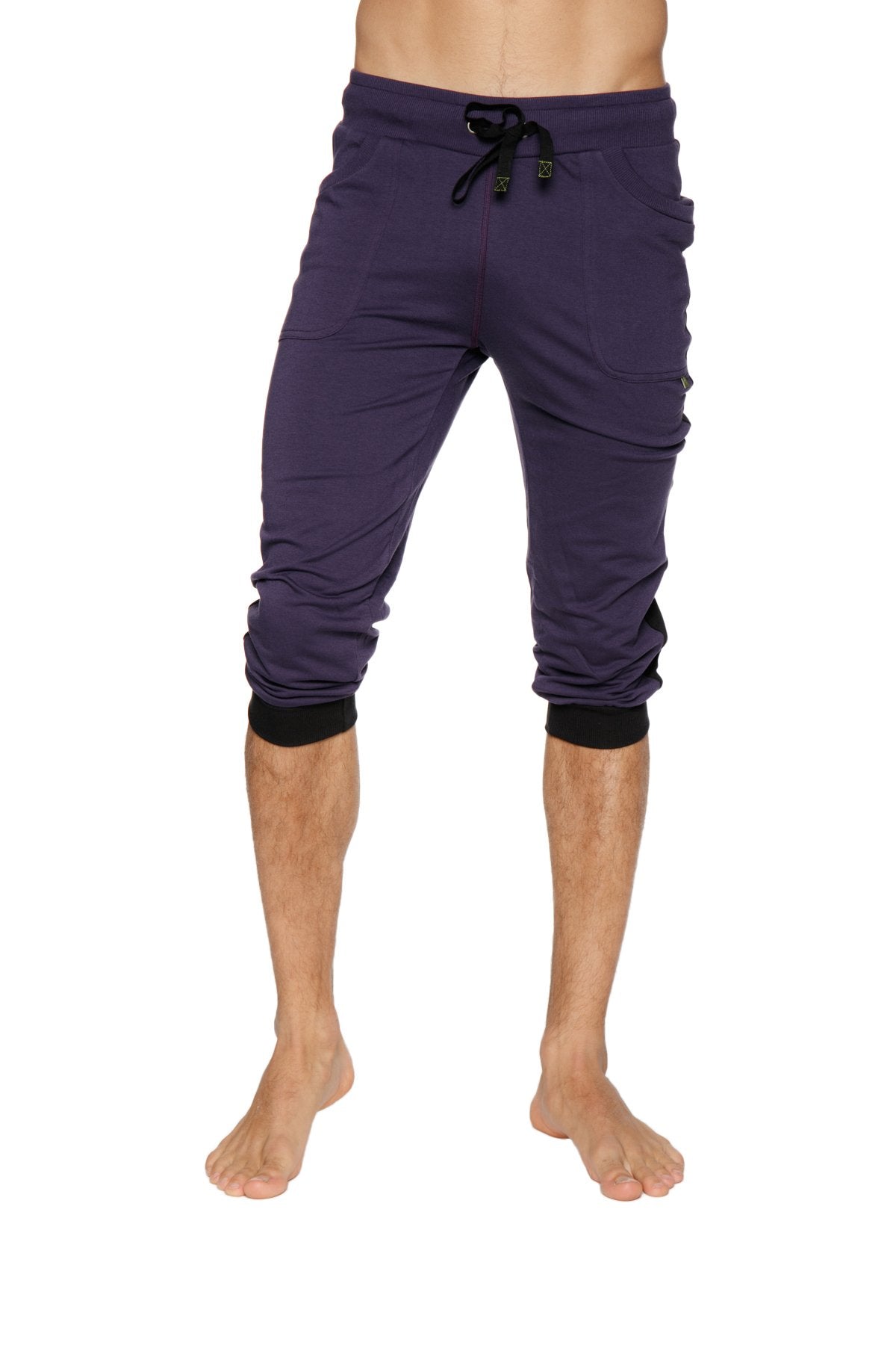 Dark purple capri-length cuffed yoga pants with black drawstring waistband and elastic cuffs for comfortable wear