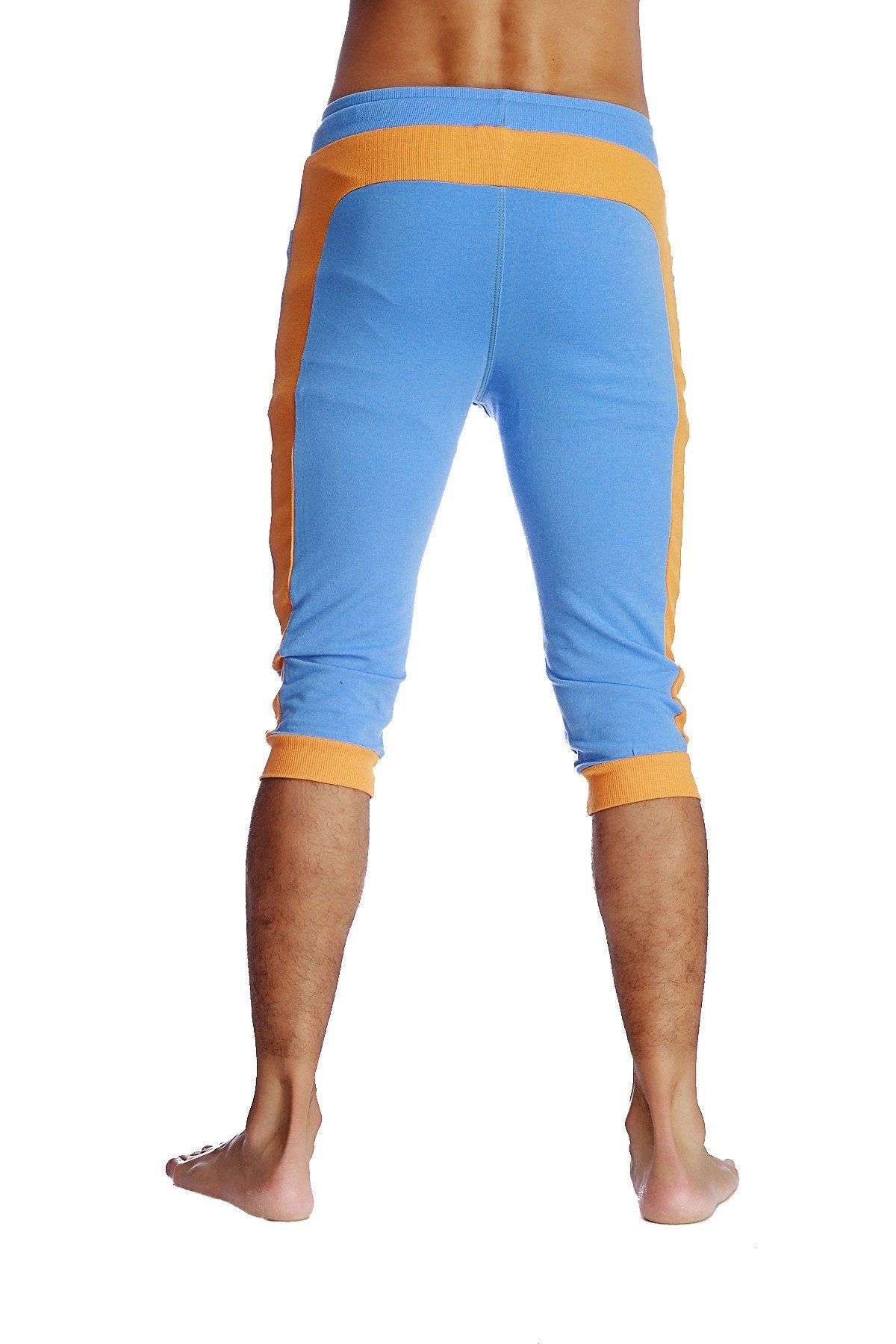 Cuffed yoga pants in ice blue with orange featuring ribbed waistband and cuffs for comfortable athletic wear