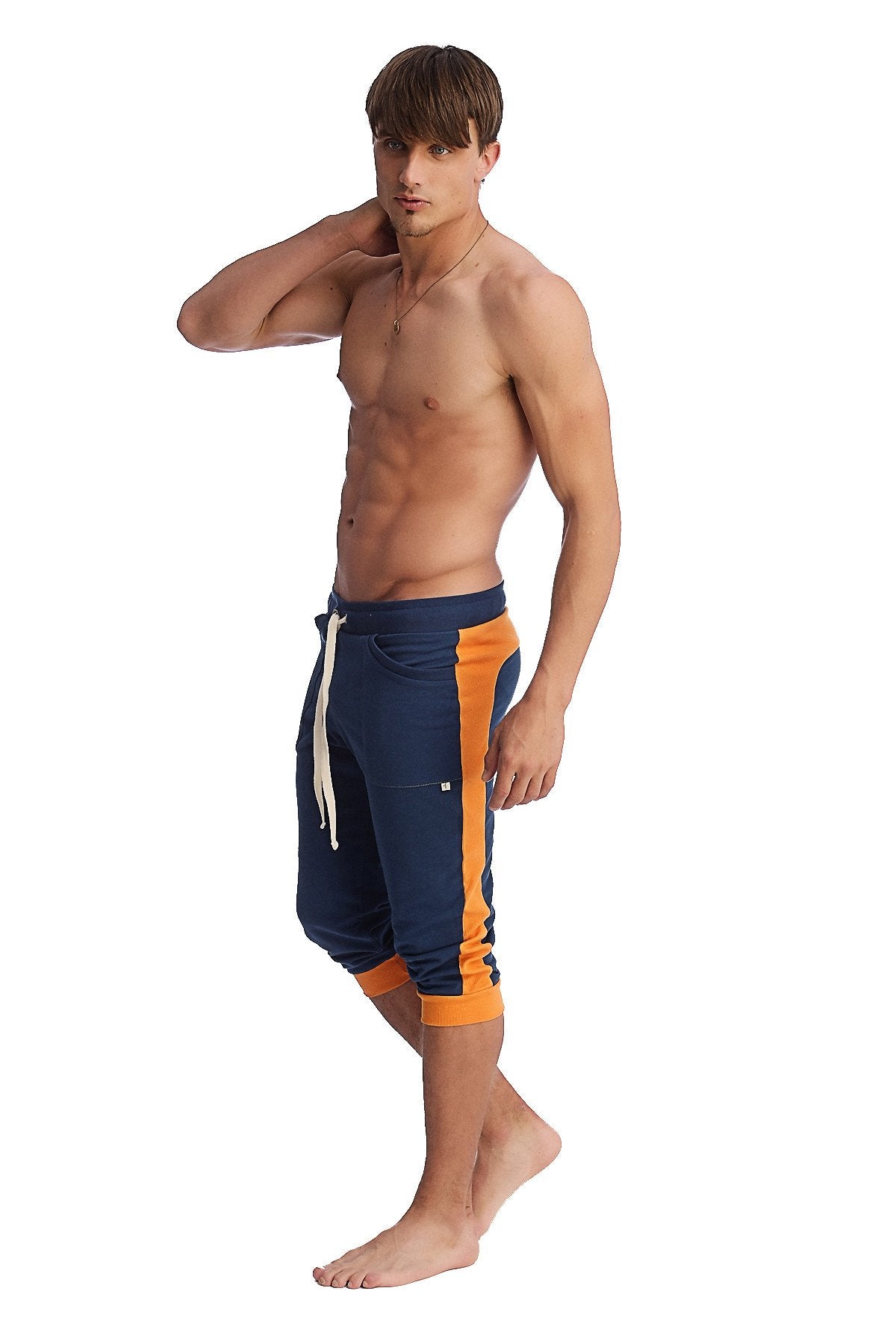 Cuffed yoga pants in royal blue and orange with white drawstring designed for athletic comfort and flexibility