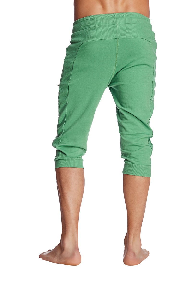 Green cuffed yoga pants made of bamboo with elastic waistband and side pockets for comfortable wear