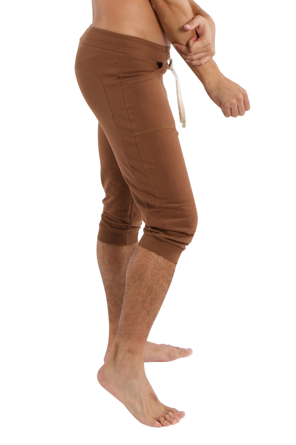 Brown cuffed yoga pants with drawstring waistband and side pockets in solid chocolate for comfortable workouts