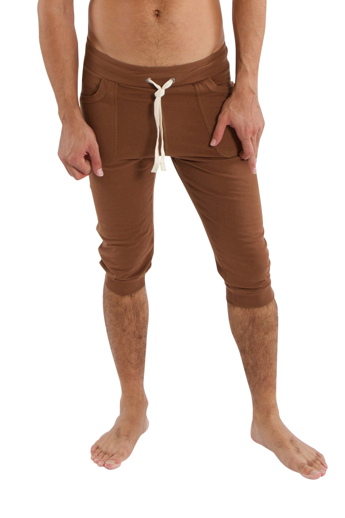 Brown cuffed yoga pants featuring a drawstring waist and side pockets perfect for comfortable activewear