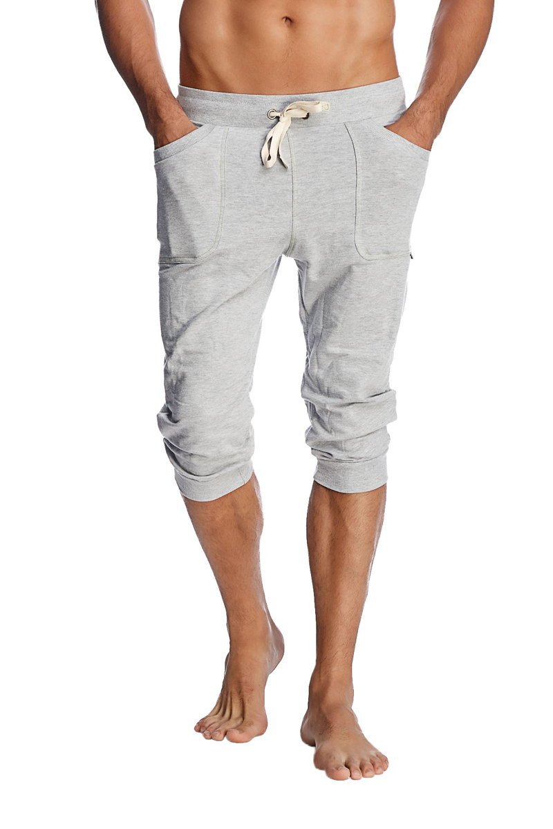 Gray heathered cuffed yoga pants with drawstring waist and rolled cuffs in jogger-style capri design