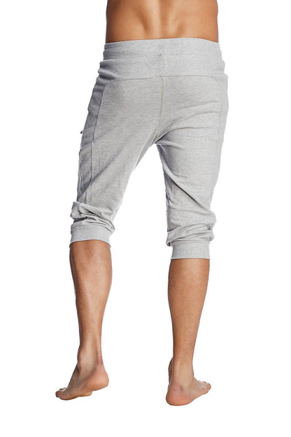 Gray heathered cuffed yoga pants with rolled cuffs and side pockets in a jogger-style capri fit