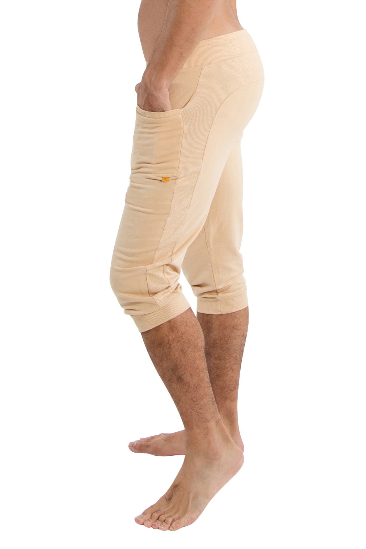 Cuffed yoga pants solid sand with side pockets and subtle yellow zipper detail in beige capri length