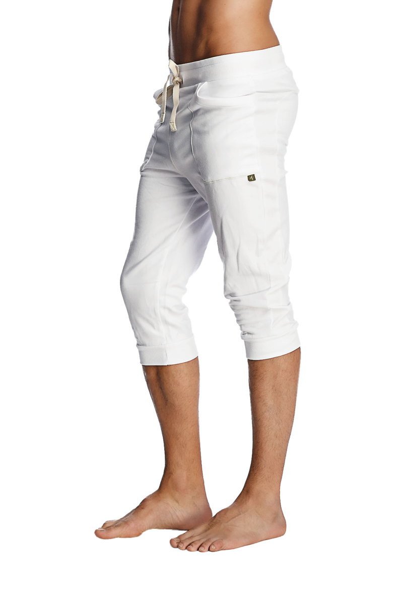 White capri-length cuffed yoga pants with drawstring waistband and subtle side pockets for comfortable wear
