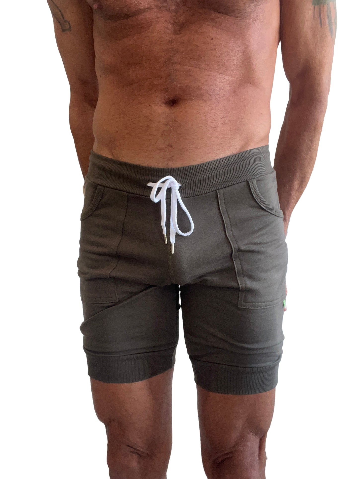 Olive green cuffed yoga shorts with white drawstring and ribbed waistband perfect for athletic wear
