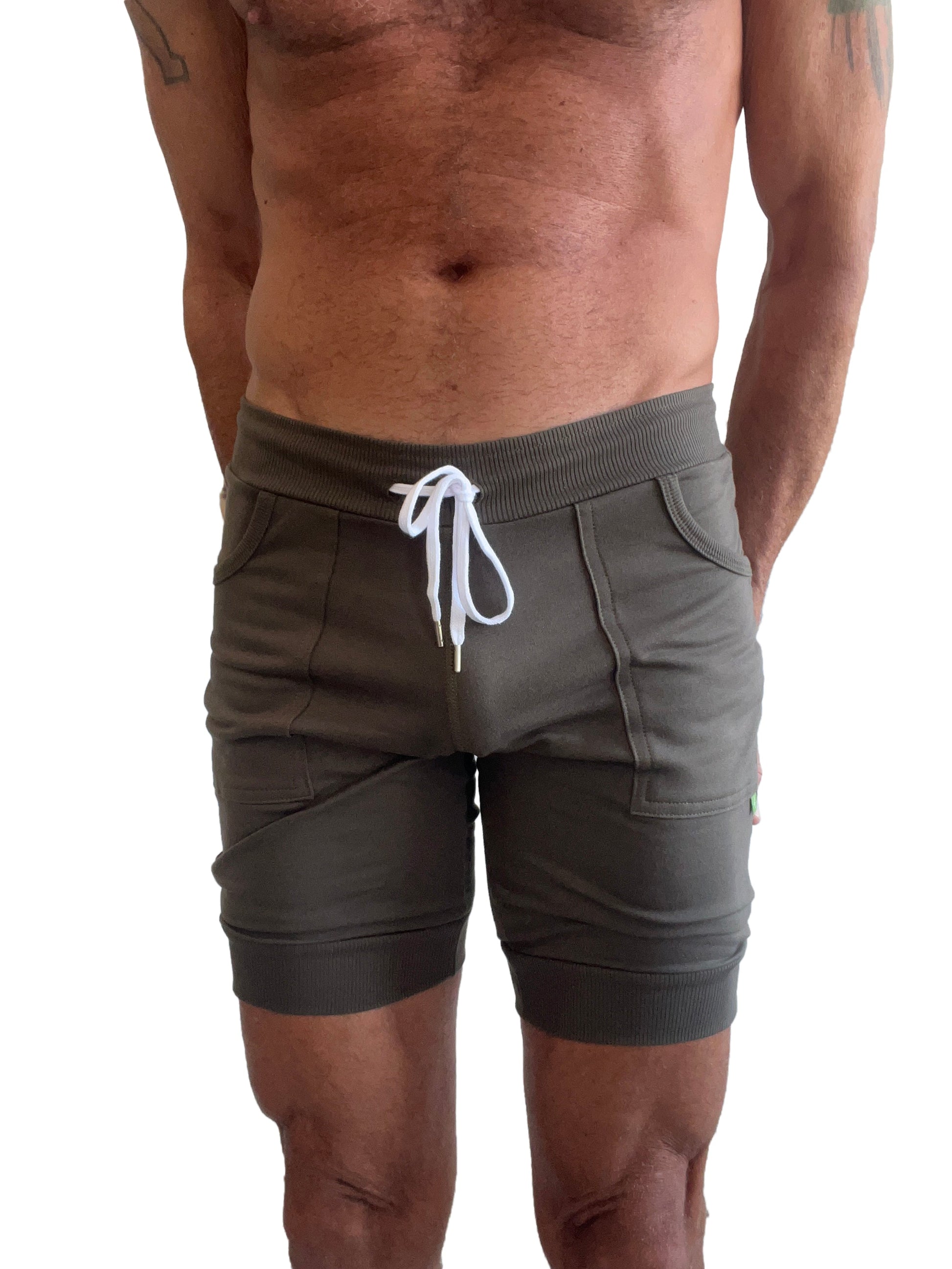 Olive green cuffed yoga shorts with white drawstring and ribbed waistband perfect for athletic wear