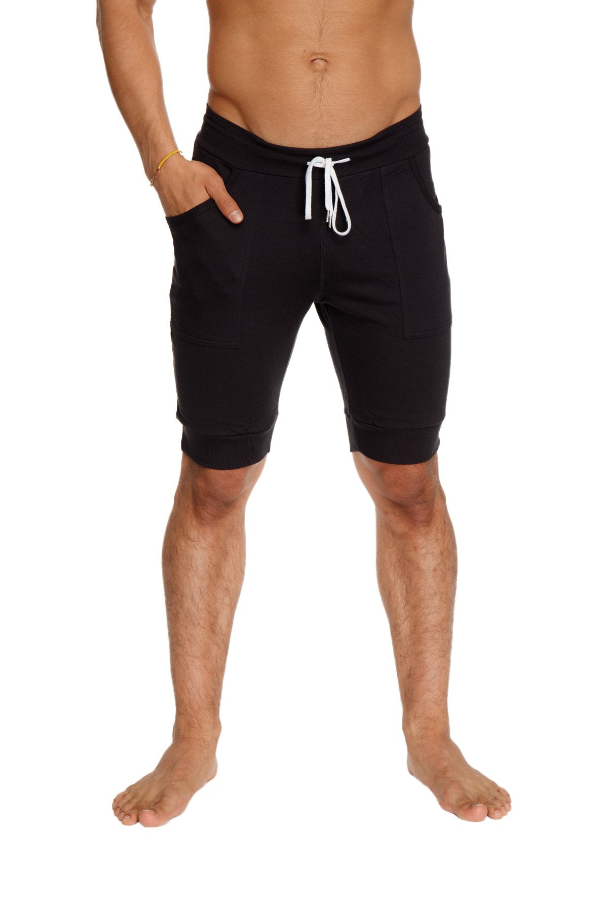 Black cuffed yoga shorts with a relaxed fit and side pockets designed for comfortable casual wear