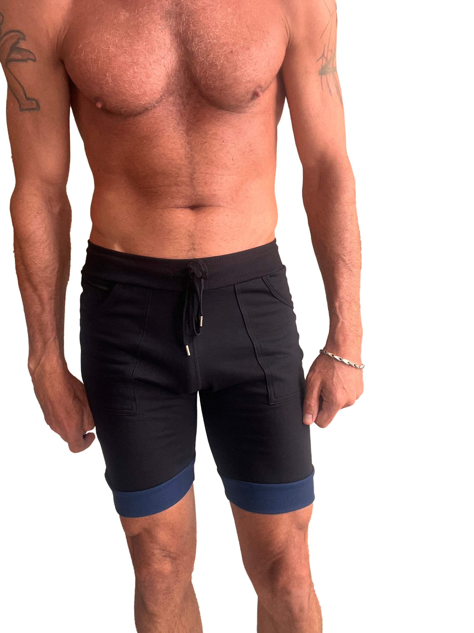 Black cuffed yoga shorts with navy blue contrast trim and drawstring waistband for athletic use