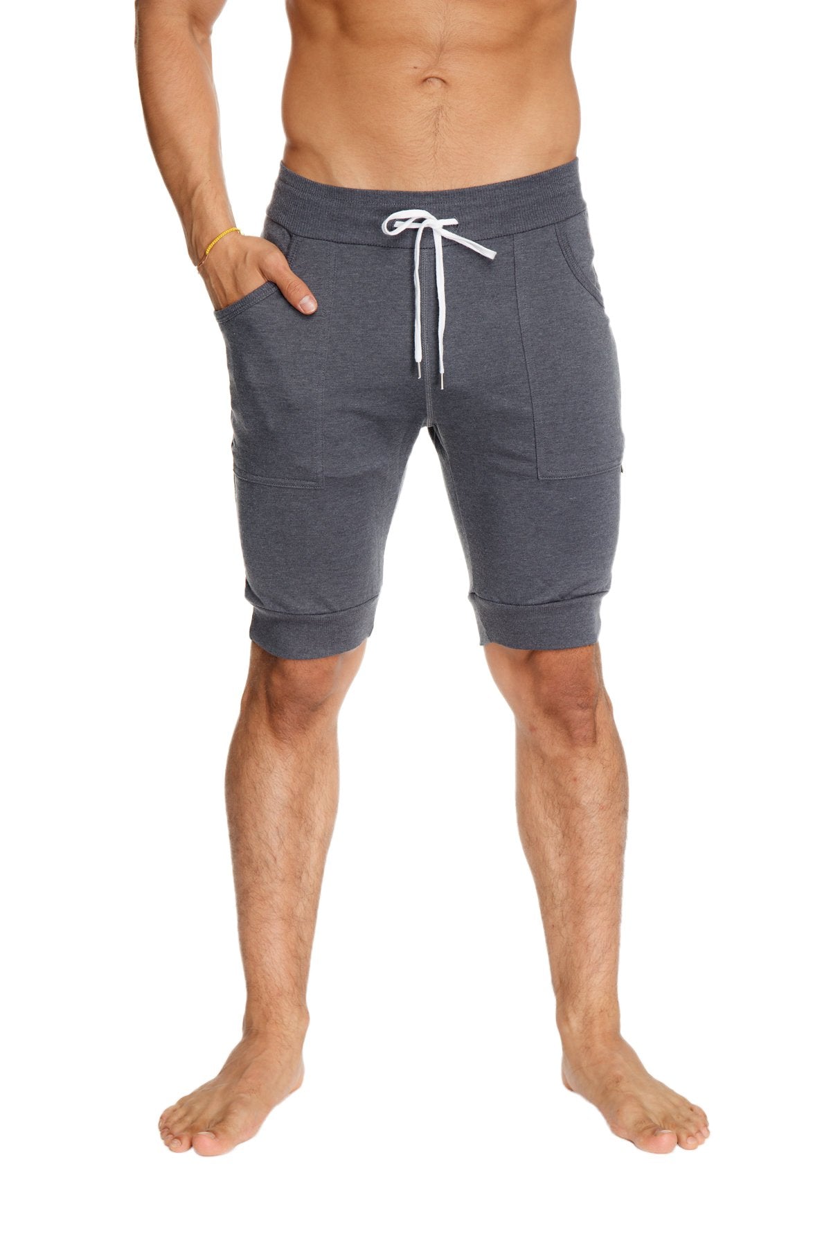 Gray cuffed yoga shorts with white drawstring and side pockets made from breathable athletic fabric