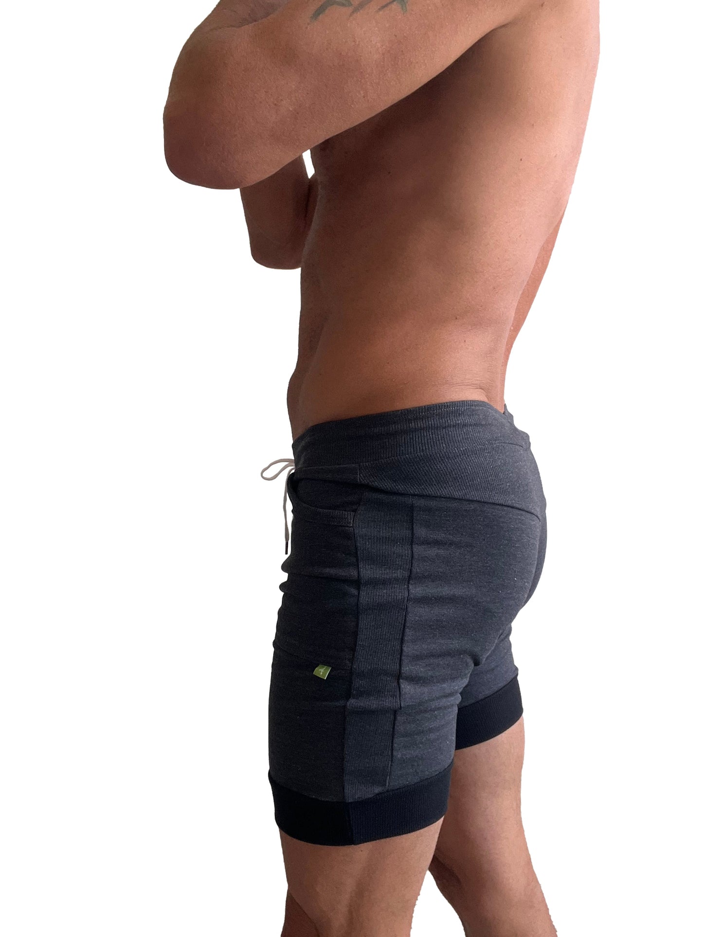 Cuffed yoga short in charcoal with black cuff featuring dark gray and black two-tone design and ribbed waistband