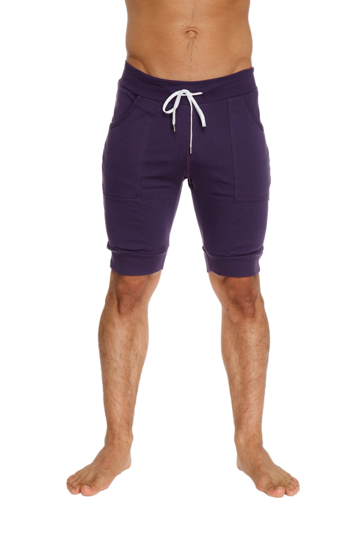 Purple cuffed yoga shorts with white drawstring and side pockets designed for comfortable athletic wear
