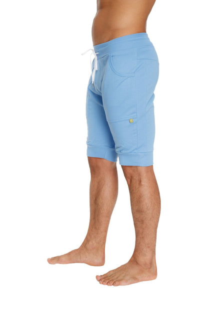 Cuffed yoga shorts in ice blue soft fabric with white drawstring and small yellow logo on side pocket
