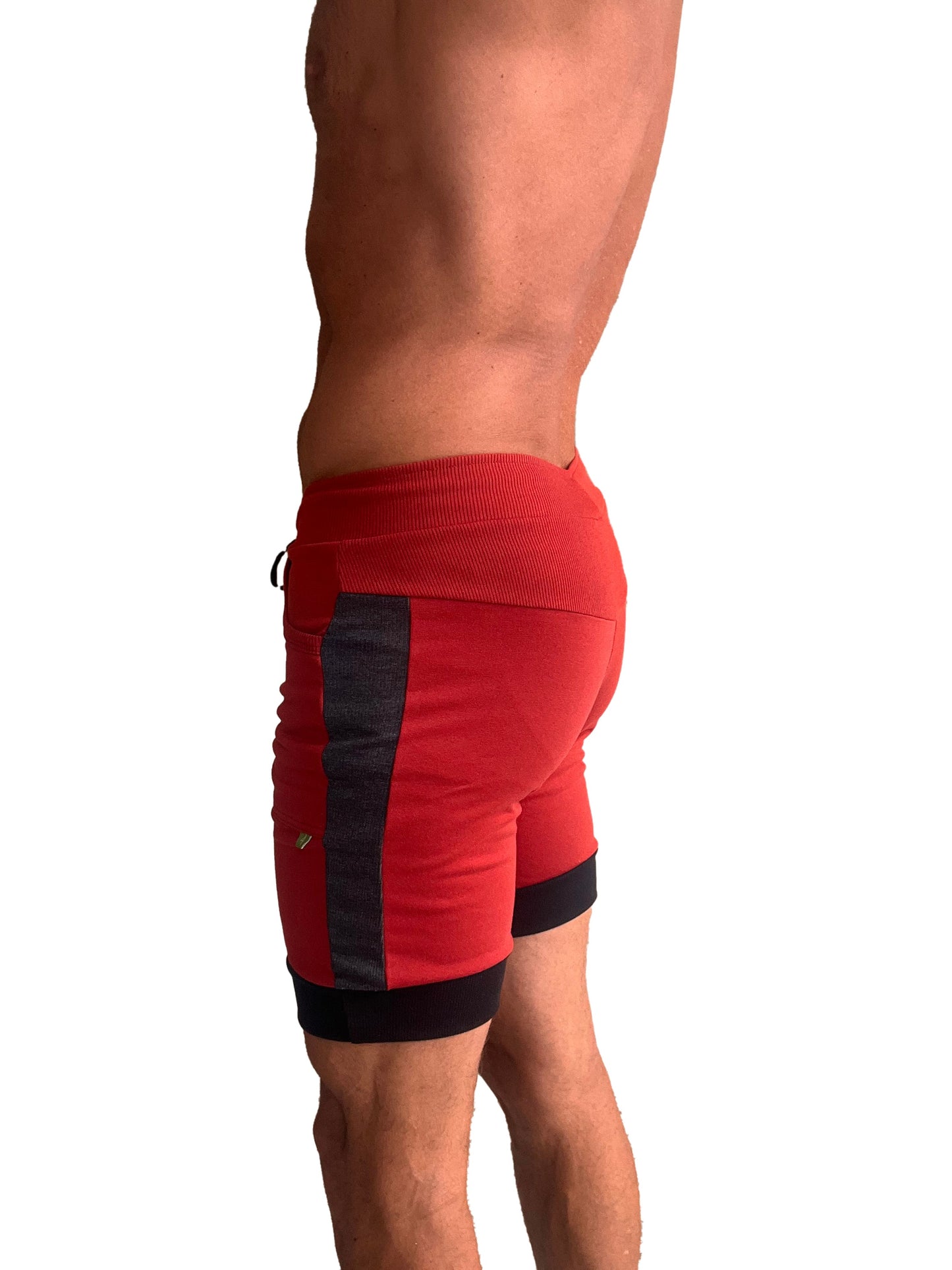 Red cuffed yoga shorts with black and charcoal side panels and ribbed waistband for athletic use