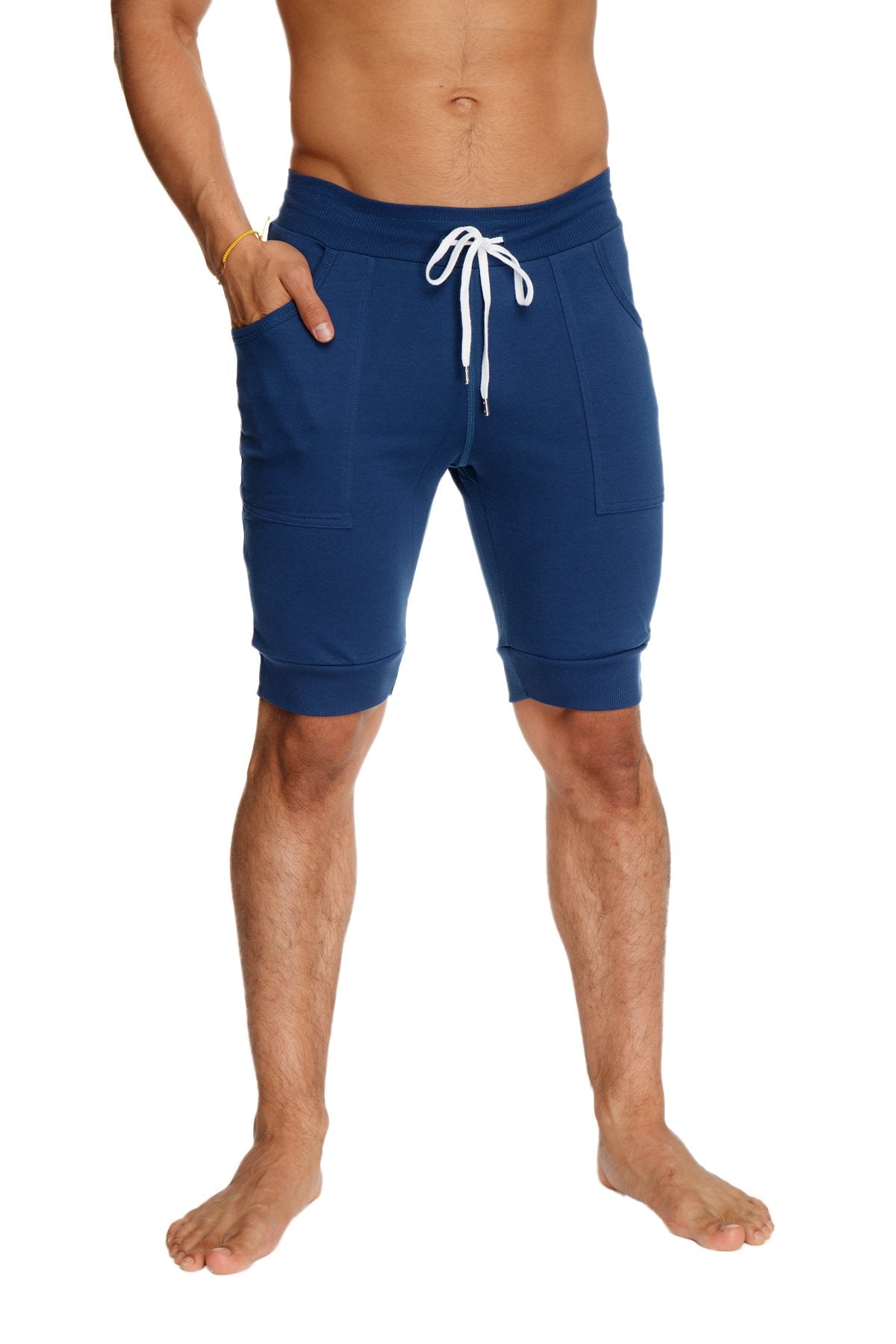 Navy blue cuffed yoga shorts with white drawstring and side pockets designed for athletic wear