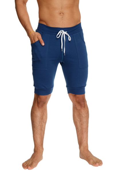 Navy blue cuffed yoga shorts with white drawstring and side pockets designed for athletic wear