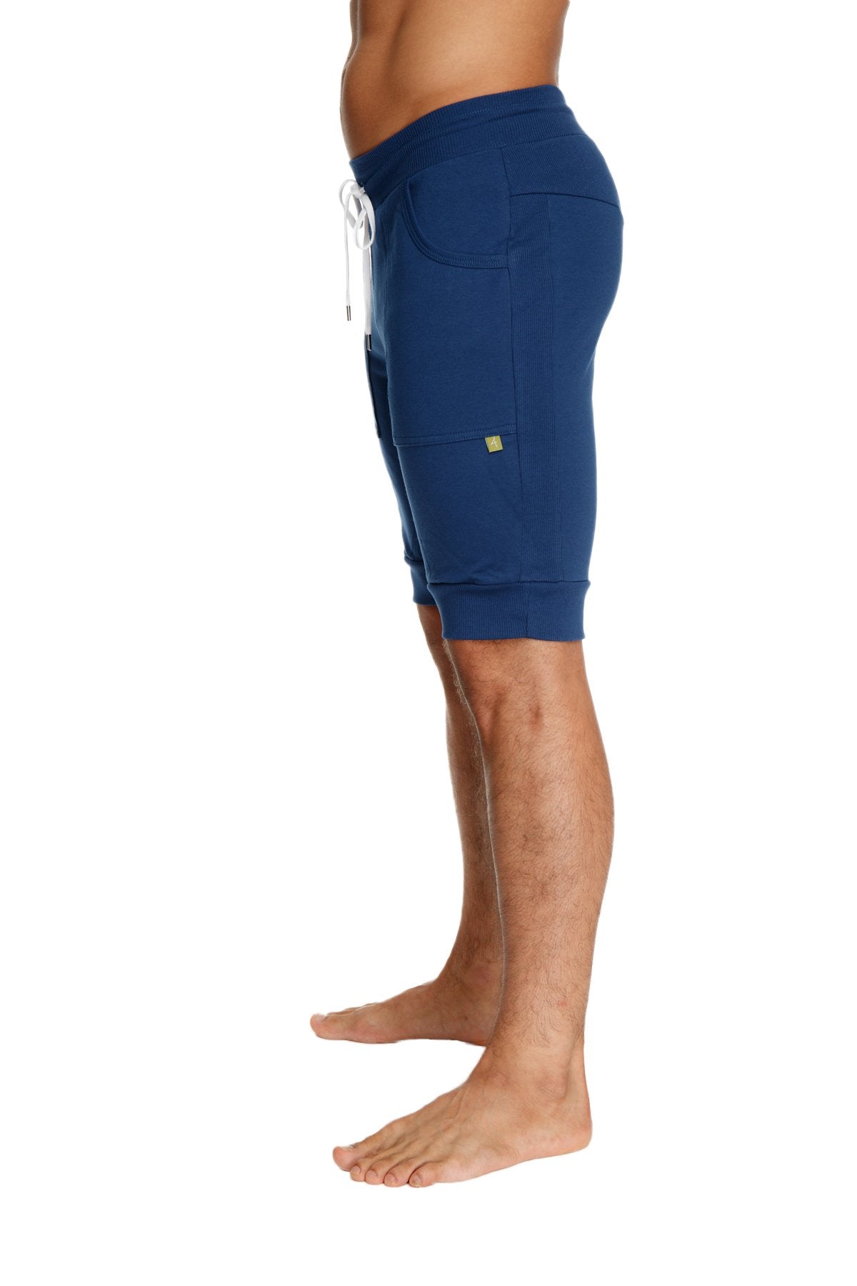 Navy blue cuffed yoga shorts with white drawstring and side pockets made from breathable fabric for athletic use