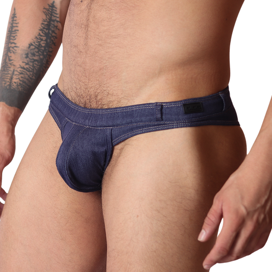 Gigo denim blue G-string thong, side view. Features blue jean-style fabric, contrast stitching, and a branded waistband.