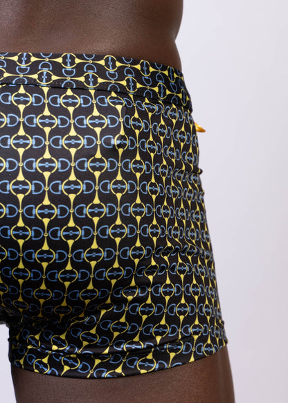 Black designer buckle print sq cut trunk swim trunks with bold yellow and light blue interlocking horseshoe logos