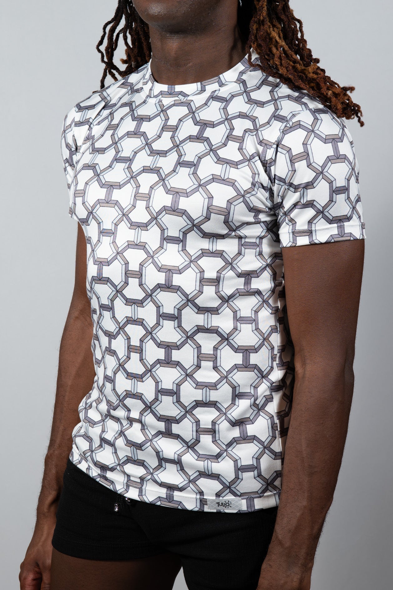 White short-sleeved rash guard with geometric gray pattern designer inspired print tee for active wear