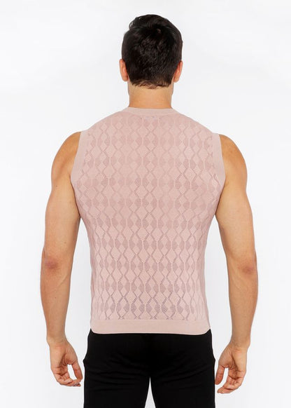 A pink knitted sleeveless vest with diamond-patterned texture made of pointelle knit fabric