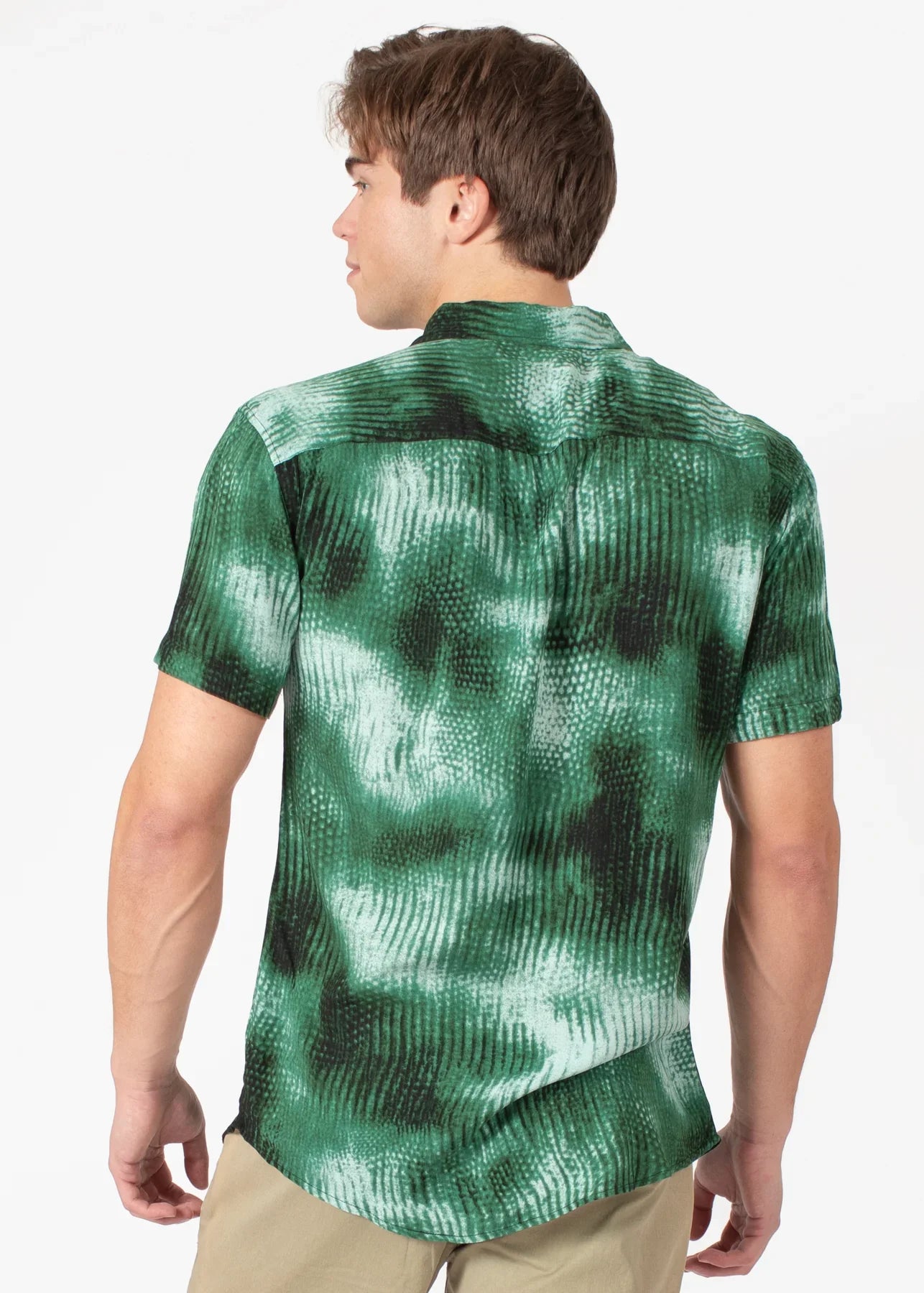 Diffuse abstract s s shirt featuring green and black tie-dye textured wavy pattern in short-sleeved button-up style