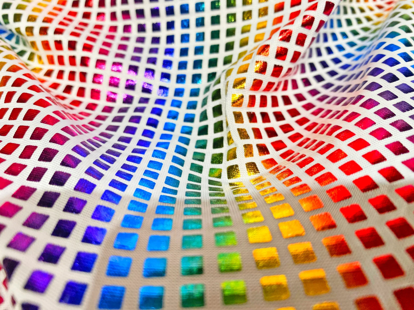Disco queen tank featuring rainbow-colored mesh fabric with iridescent square tile grid for a vibrant look