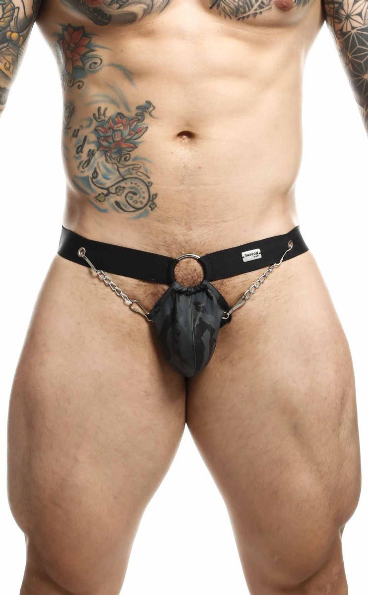 Black leather harness-style briefs with a central ring and attached chains from dngeon chain jockstrap collection