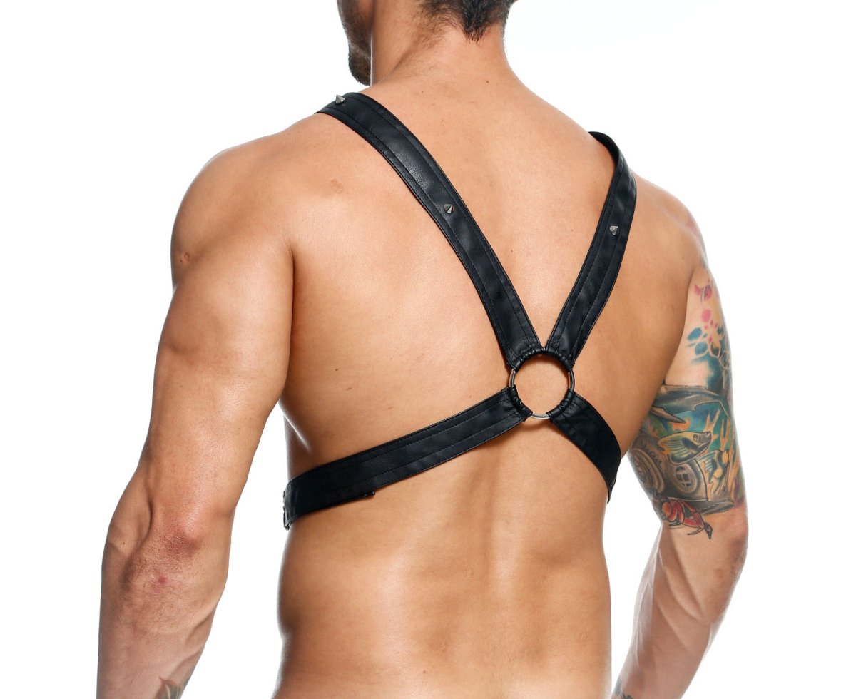 Black leather cross chain harness by DNGEON with adjustable straps and central ring for secure fit