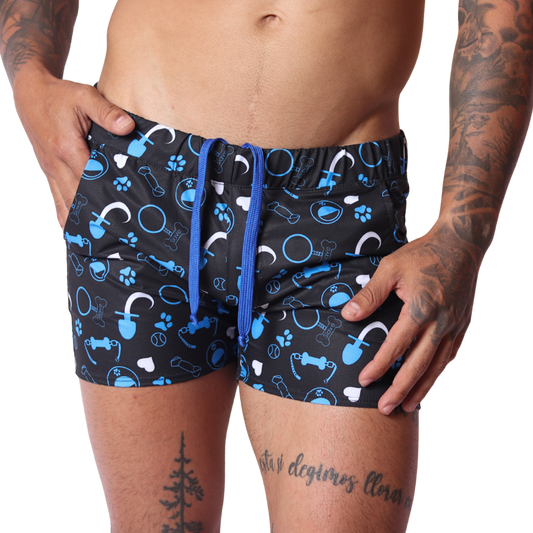 Front view of Gigo blue and black dog-themed print athletic fabric shorts with a drawstring waist.