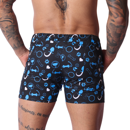 Back view of Gigo blue fabric shorts featuring a black and blue print with dog toys, paw prints, and collars.