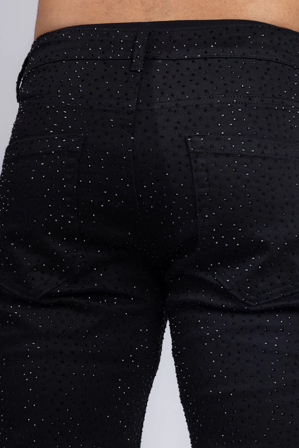 Black denim dolorosa rhinestone jeans with subtle glittery dot pattern across the fabric