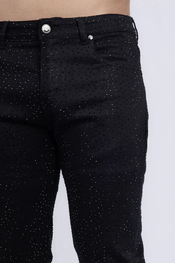 Black denim dolorosa rhinestone jeans with subtle glittery dot pattern and silver toned button front view
