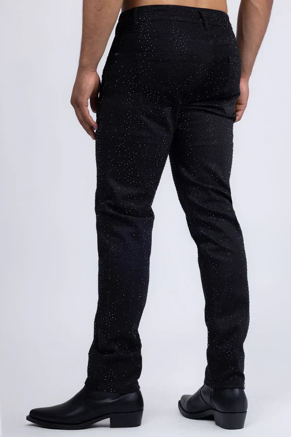 Dolorosa rhinestone jeans are black denim with a subtle glittery speckle pattern for a sparkling casual look