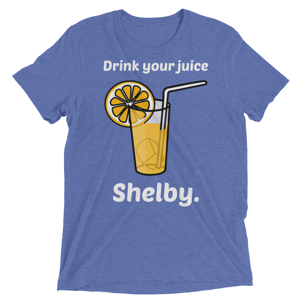 Blue heathered t-shirt featuring a cartoon glass of orange juice with lemon slice and text drink your juice shelby