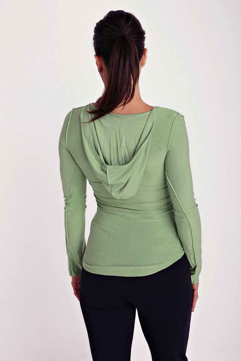 Soft sage green bamboo long sleeve top with deep scoop neck and draped hooded back shown from back side