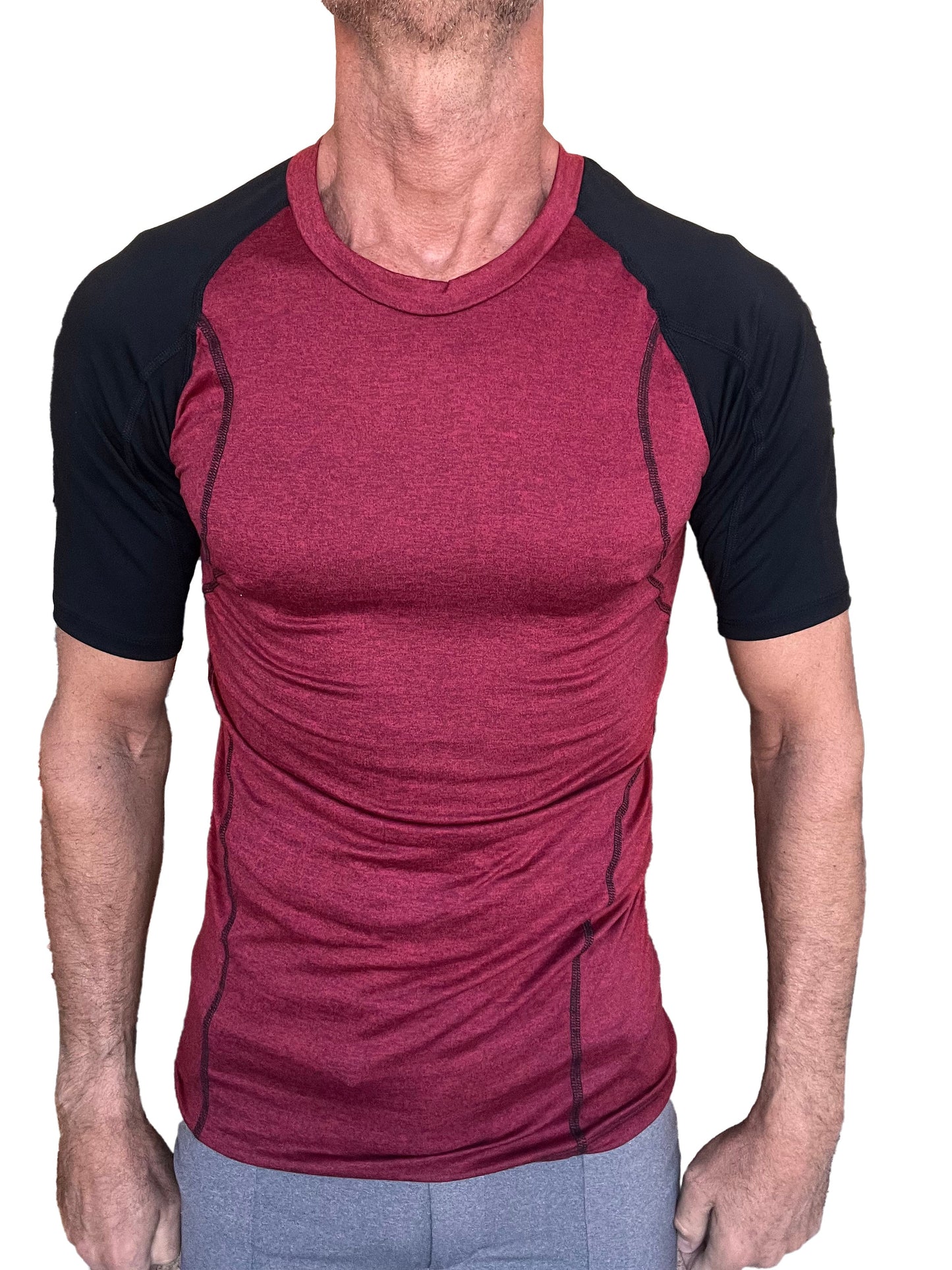 Designer raglan crew neck tee brick with black sleeve featuring maroon and black textured raglan athletic fabric