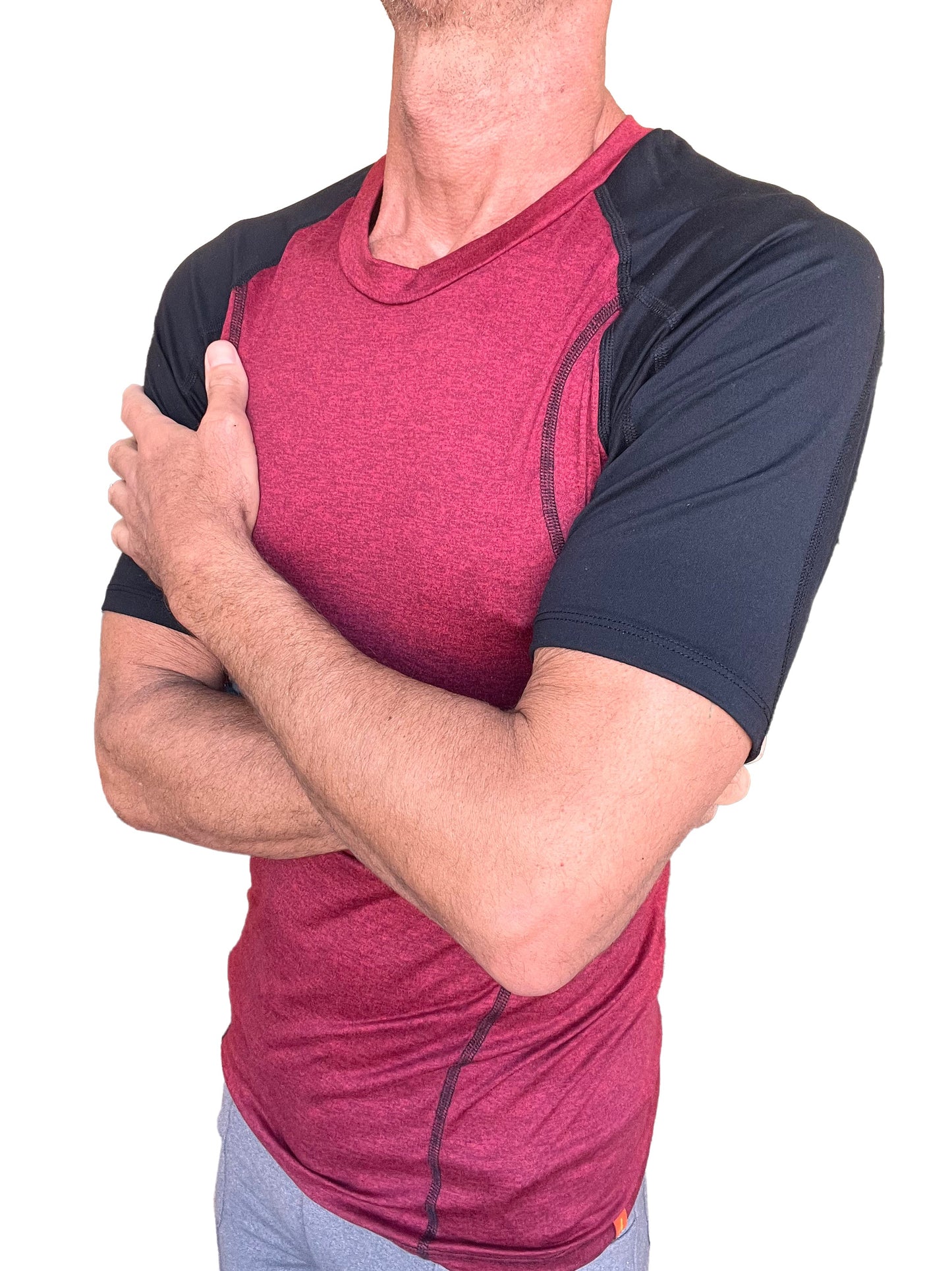 Designer raglan crew-neck tee in brick with black raglan sleeves and subtle seam detailing for athletic wear