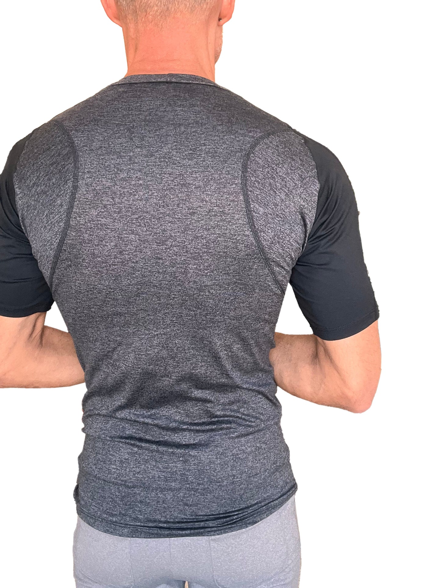 Men’s designer raglan crew-neck tee with heathered charcoal body, black sleeves, and performance seam detailing