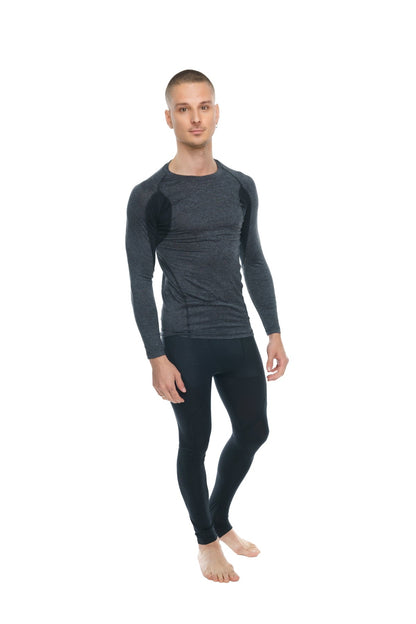Black long-sleeved compression shirt with subtle textured panels on shoulders and torso in charcoal with black accent