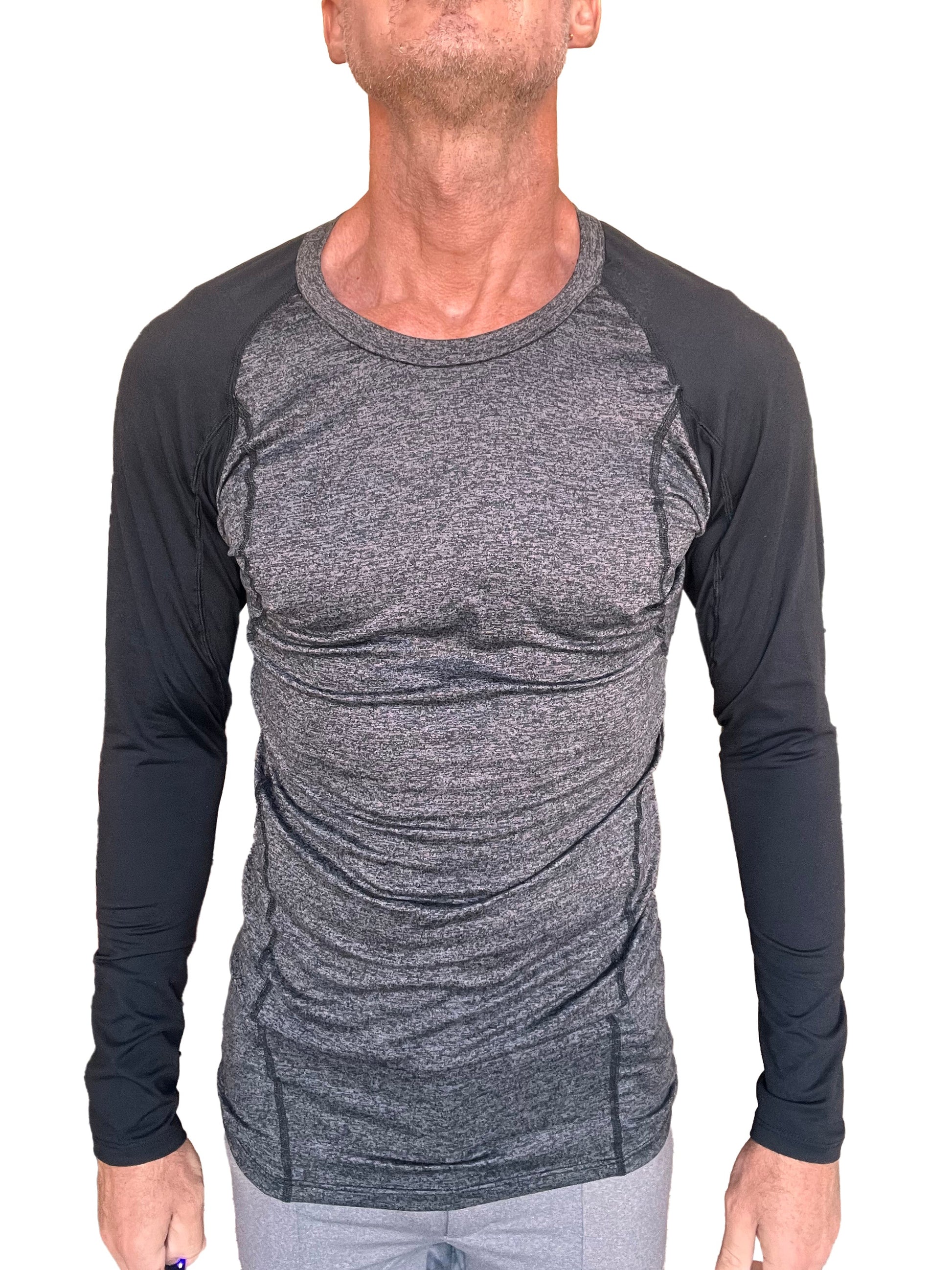 A men’s designer raglan crew-neck long sleeve tee with a heather gray torso and black sleeves in fitted athletic style